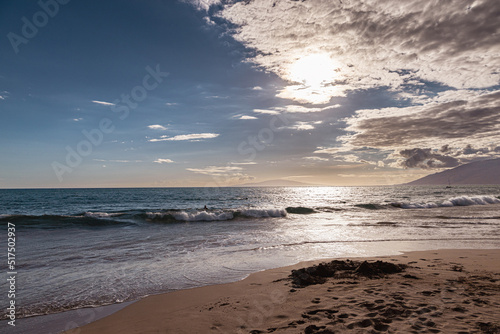 Fototapeta Naklejka Na Ścianę i Meble -  Maui Hawaii beach coastline of sand, sun, and blue water with crashing
