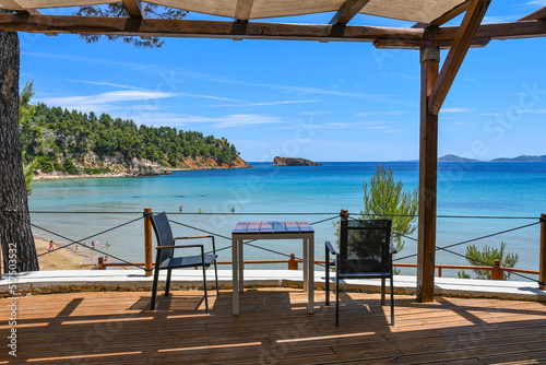 Fototapeta Naklejka Na Ścianę i Meble -  Beautiful restaurant view towards Chrisi Milia beach in Alonissos island, Greece