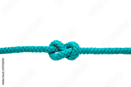 Knot on a cord isolated on a white background .