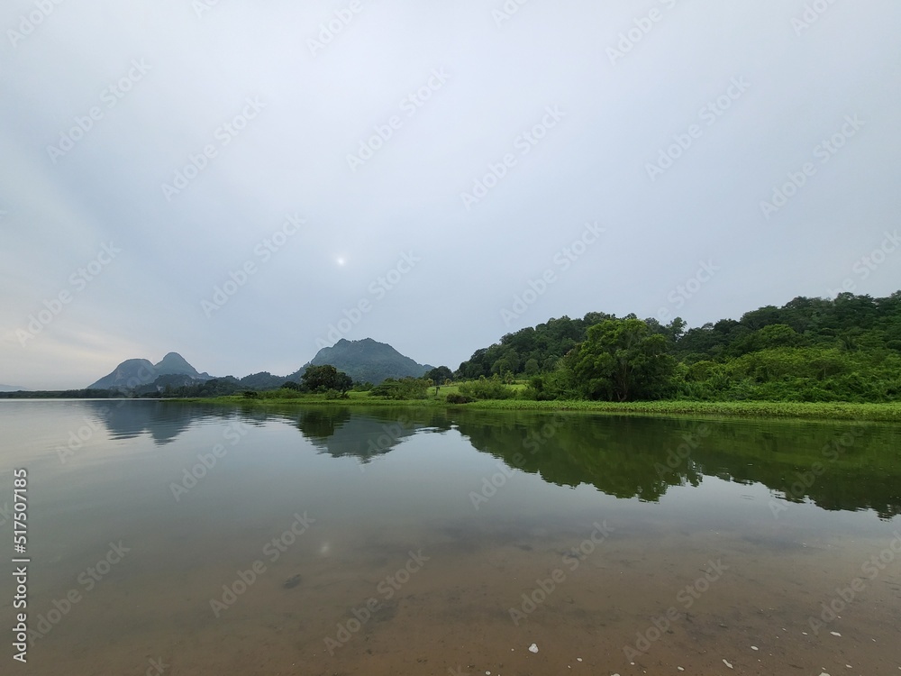 Tranquil landscape in Lake Timah Tasoh, Perlis, Malaysia during cloudy morning.