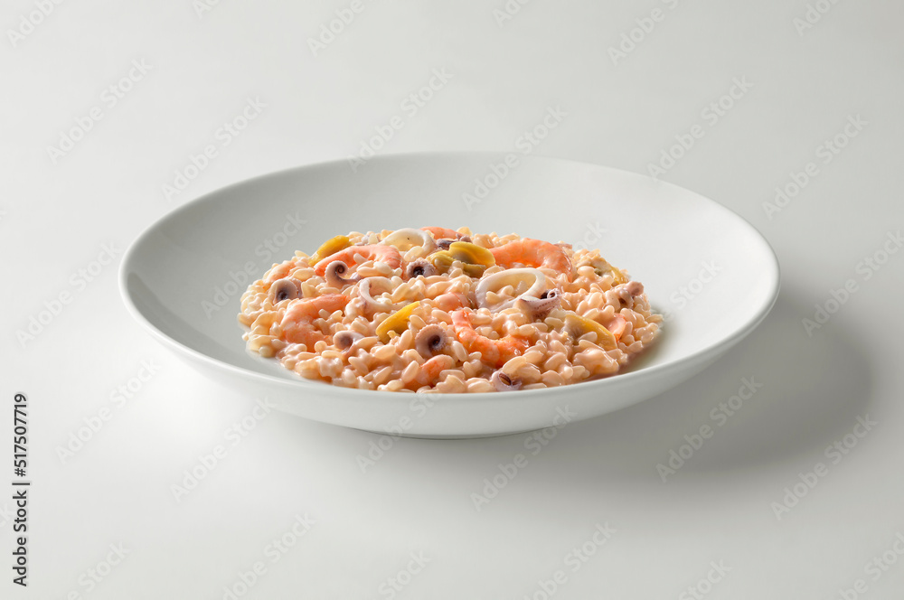 White bowl with fish risotto White bowl with fish risotto
