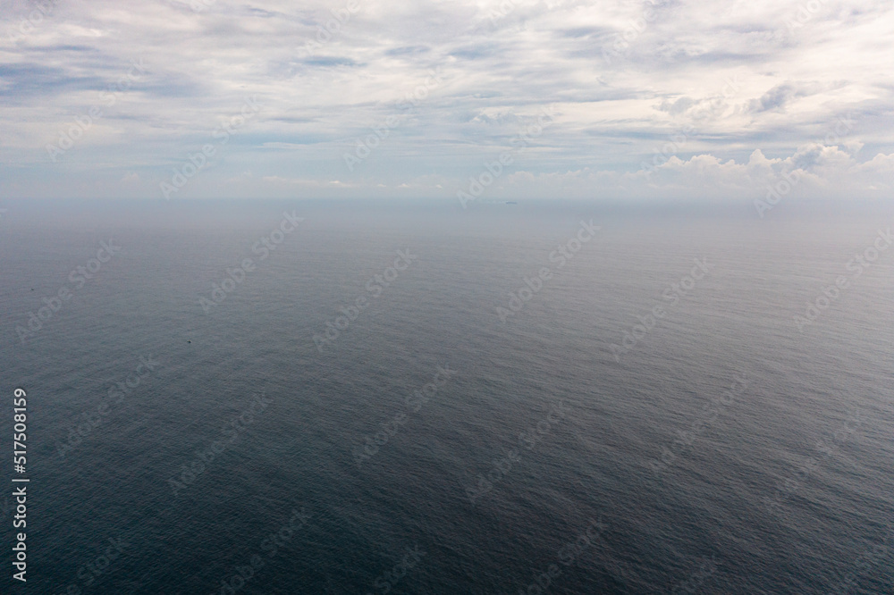 Top view of blue sea with waves and sky with clouds. Ocean skyline. Top view of blue sea with waves and sky with clouds. Ocean skyline.