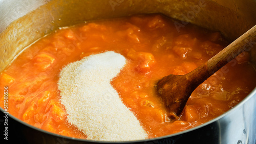 Cooking apricot marmalade with sugar