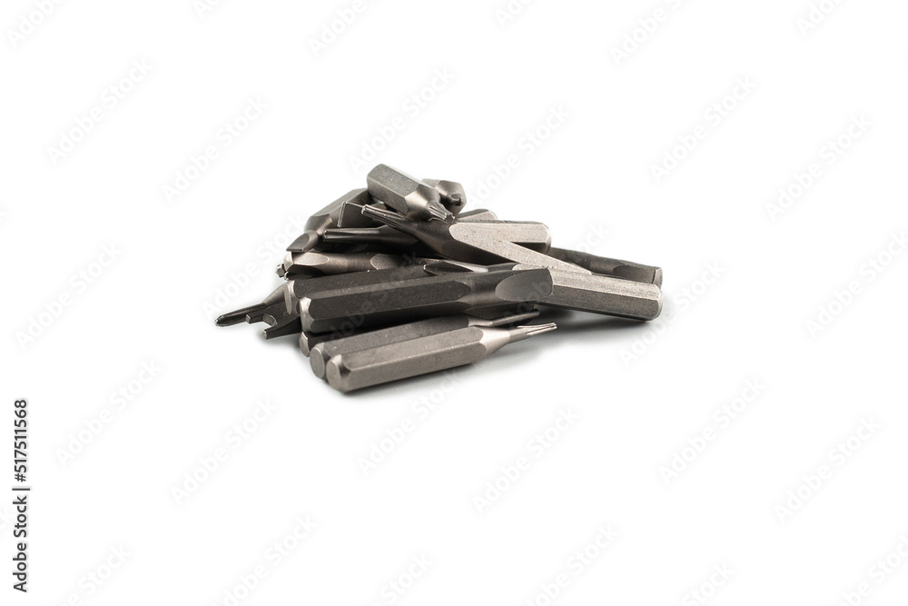 Isolated on a white background tips of a group of phillips head screwdriver bits. Top view. Isolated on a white background tips of a group of phillips head screwdriver bits. Top view.
