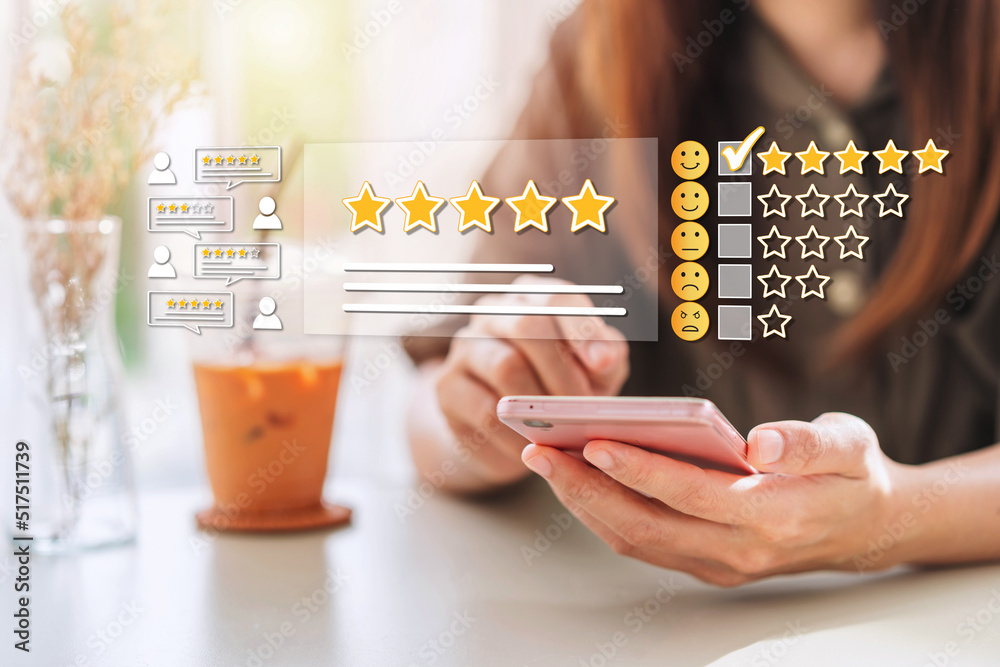 Young woman traveler using smartphone to give a five-star satisfaction rating of the food and drinks at restaurant on social media, Travel lifestyle concept - obrazy, fototapety, plakaty 