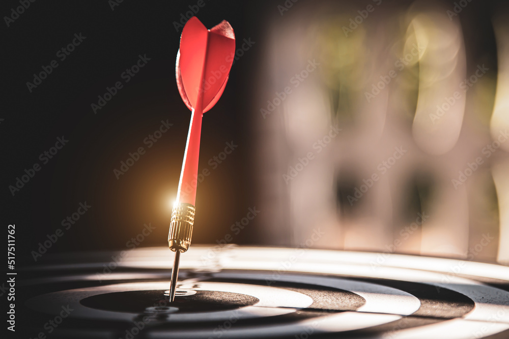 Bullseye target goal or dartboard has dart arrow throw hitting center shooting for financial business targeting planning to winner concept. Bullseye target goal or dartboard has dart arrow throw hitting center shooting for financial business targeting planning to winner concept.