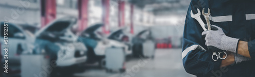 Wallpaper Mural Hands of car mechanic with wrench in garage.Car care maintenance and servicing concept. Torontodigital.ca