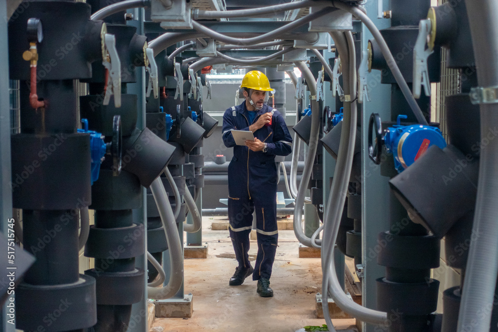 Plakat Engineer under checking the industry chilled water fan coil unit ...