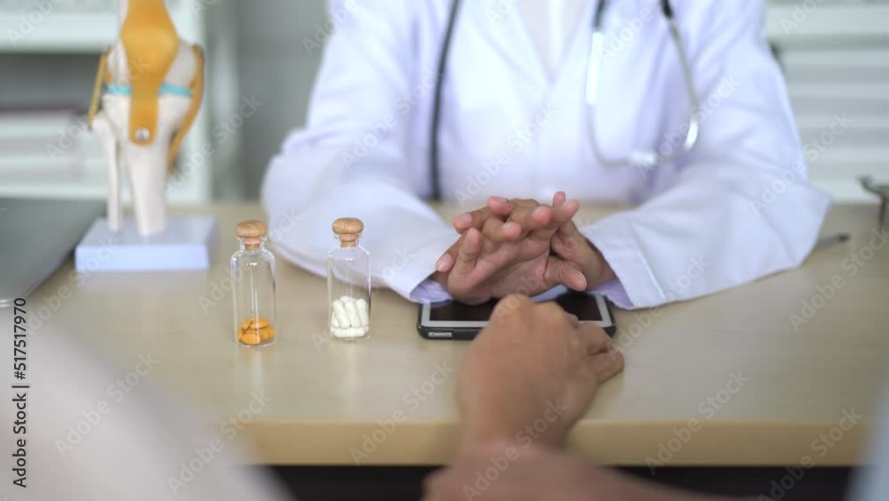 Asian elder woman and her son having a consulting with doctor. Asian elder woman and her son having a consulting with doctor.
