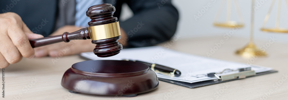 Lawyer or judge holding Hammer prepares to judge the case with justice, Legal consulting services and litigation, scales of justice, law hammer, Concept of litigation and legal services Lawyer or judge holding Hammer prepares to judge the case with justice, Legal consulting services and litigation, scales of justice, law hammer, Concept of litigation and legal services