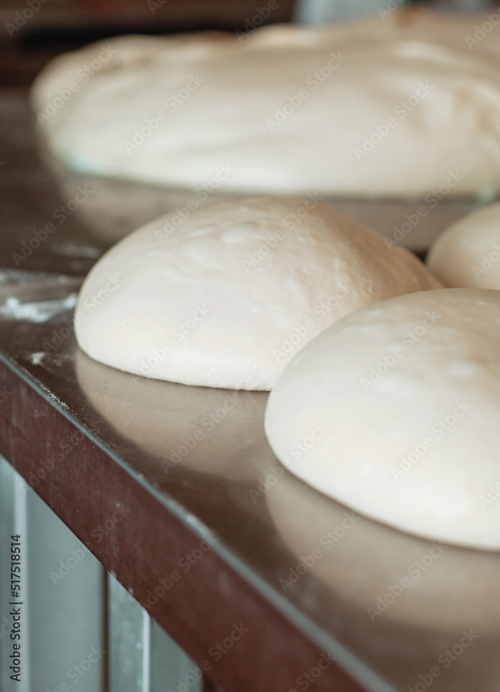 shaped bread raw dough before baking on the table in bakery shaped bread raw dough before baking on the table in bakery
