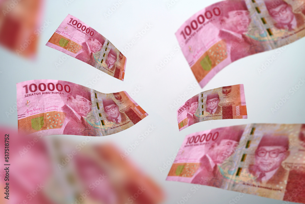 One Hundred Thousand Rupiah Banknote Flying On A White Background Uang one-hundred-thousand-rupiah-banknote-flying-on-a-white-background-uang