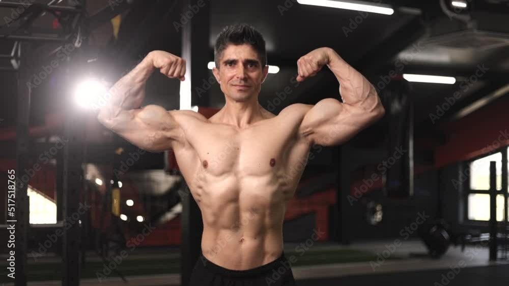 attractive shirtless mature male bodybuilder with perfect torso posing muscular body in gym
attractive shirtless mature male bodybuilder with perfect torso posing muscular body in gym