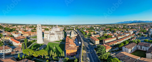 Pisa, Italy - Field of Miracles Square and city homes. Amazing panoramic aerial view at dawn