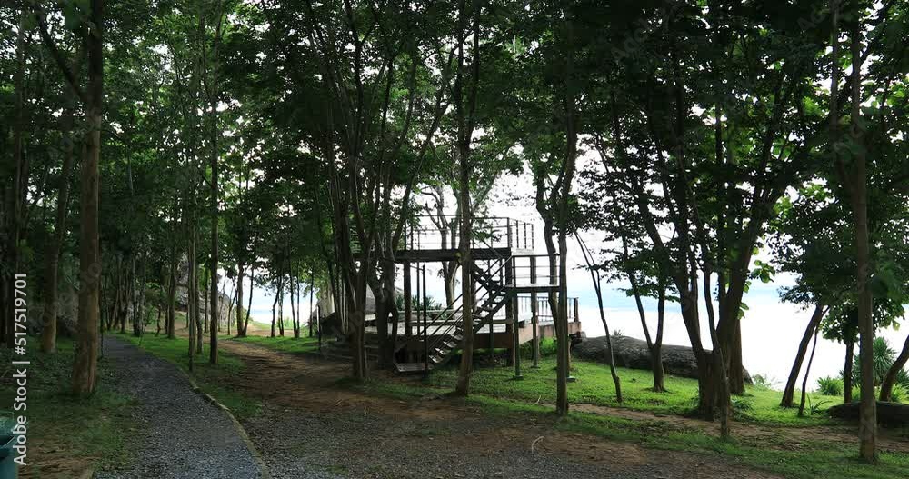 video background 4K of the morning sun rising in the middle of the sea, small fishing boats and many kinds of birds flying past in blur, the beauty of seaside community life.