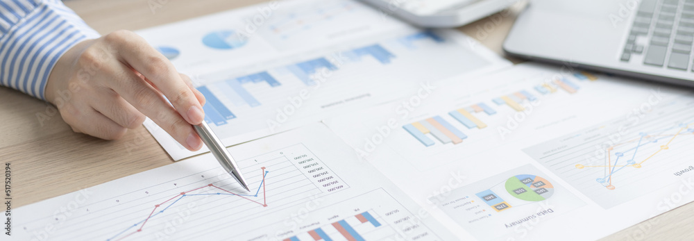 Asian business women are analyzing graphs, financial statistics and calculating corporate returns in private offices, Market research reports and income statistics, Financial and Accounting concept. Asian business women are analyzing graphs, financial statistics and calculating corporate returns in private offices, Market research reports and income statistics, Financial and Accounting concept.