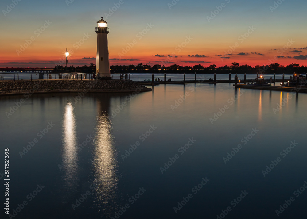 Sensational Sunset with a Lighthouse at a Marina