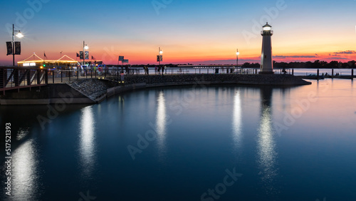 Принти на полотні Sensational Sunset with a Lighthouse at a Marina