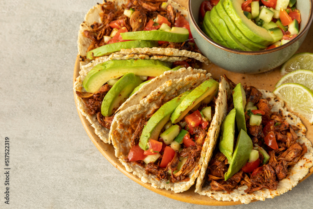 Shredded jackfruit tacos with avocado and pico de gallo. Stock Photo