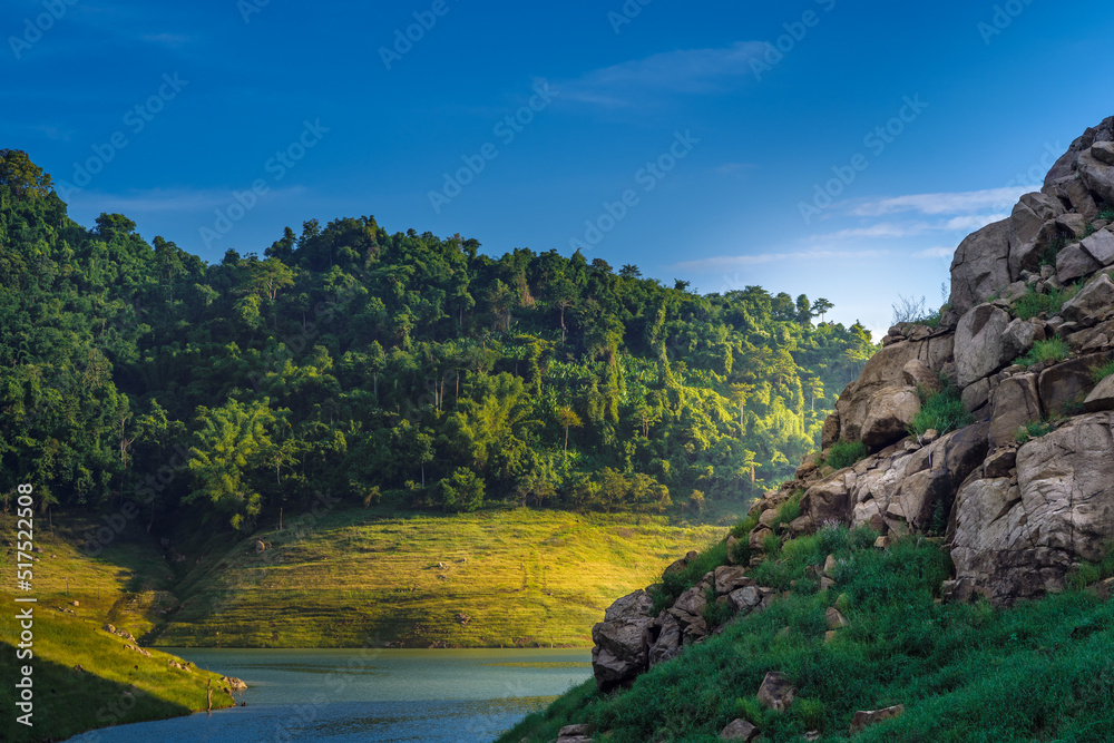 Khao Chong Lom Green Mountain with meadow and river at Khun Dan Prakarn Chon Dam Nakhon Nayok Thailand. Khao Chong Lom Green Mountain with meadow and river at Khun Dan Prakarn Chon Dam Nakhon Nayok Thailand.
