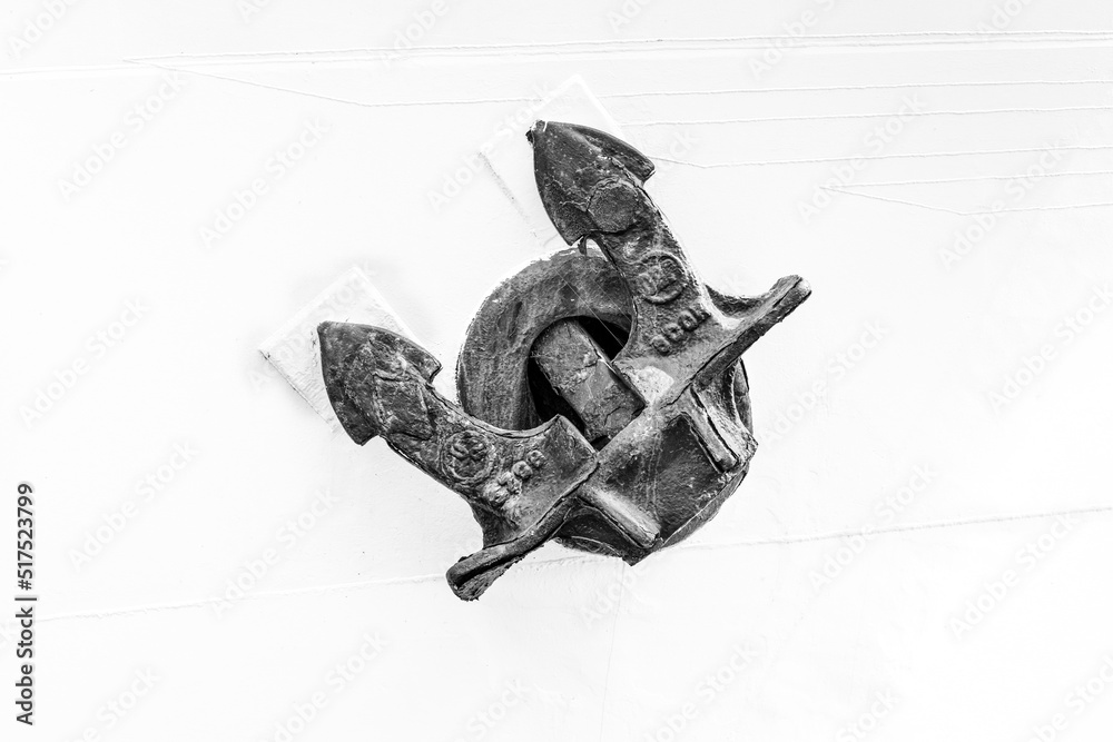 Fototapeta premium Hamburg, Germany. Historic anchor on a white ship wall.