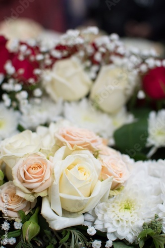 Floral composition of white and cream roses and chrysanthemums