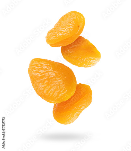 Delicious dried apricots in the air closeup on a white background