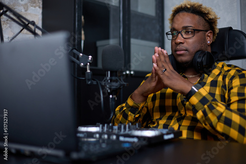 Vászonkép Young African man, a professional music producer, composer, sound engineer, arranger working in a home recording studio