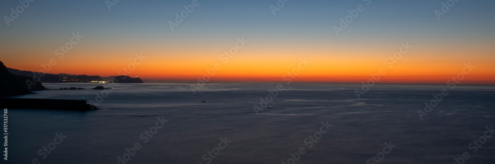 Line of the horizon on the sea at dusk