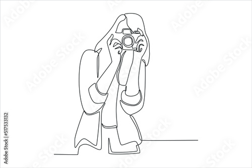 Continuous one line drawing Woman photographer is taking images with camera. World photo day concept. Single line draw design vector graphic illustration.