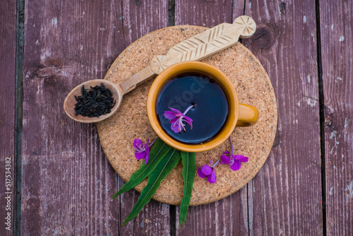 Ivan tea or chai. Herbal tea from fireweed flowers in a cup on natural stone background. Traditional Russian kopor tea.
