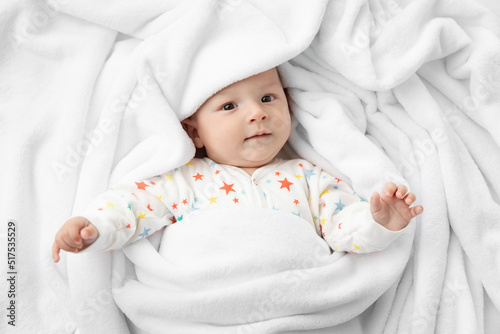 Newborn baby wrapped in polar fleece blanket