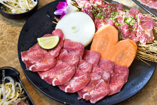 Japanese grilled meat, Beef tongue sliced yakiniku, BBQ korean roast, Asian traditional food.