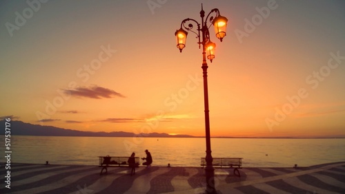 A background photo with a street lamp on the sea shore