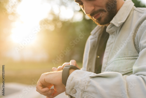 Touch Screen Wearable Technology Smart Band. Bearded Man Using Smart Watch Wearable Wristband Device. Male Checking Pulse Smartwatch App. Businessman Scrolling On Display On Smartwatch Notification