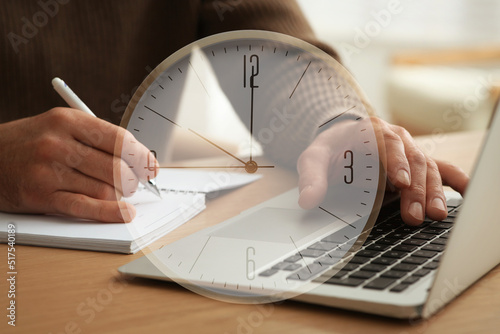 Double exposure of man working with laptop and clock photo