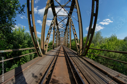 Railway viaduct in the UWA wide-angle lens on a sunny day. Summer. © W Korczewski