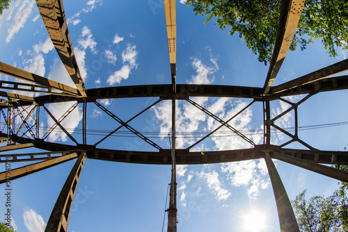 Railway viaduct in the UWA wide-angle lens on a sunny day. Summer. photo