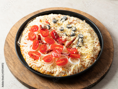 pizza with tomatoes and olives