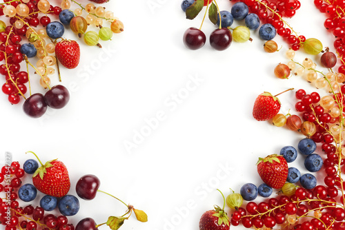 Fototapeta Naklejka Na Ścianę i Meble -  Various fresh summer berries frame on white background. Top view