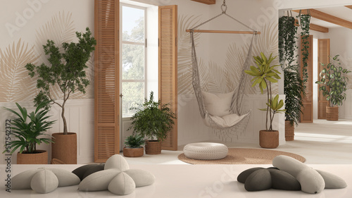 White table, desk or shelf with five soft white pillows in the shape of stars or flowers, over cuntry living room with rattan lace hanging chair, white architecture interior design photo