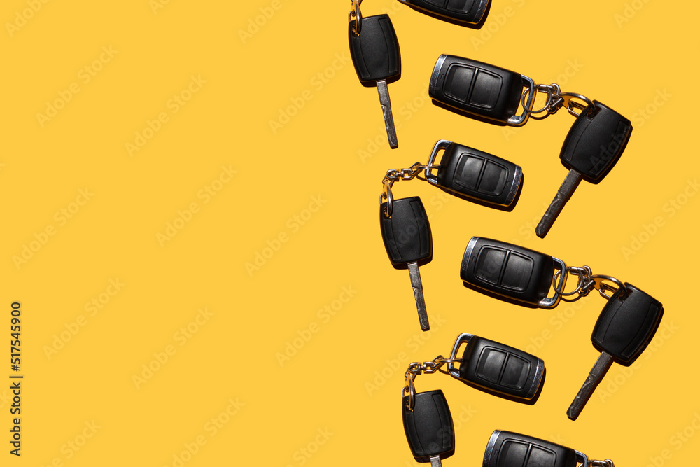 keys and car alarms on an orange background keys and car alarms on an orange background