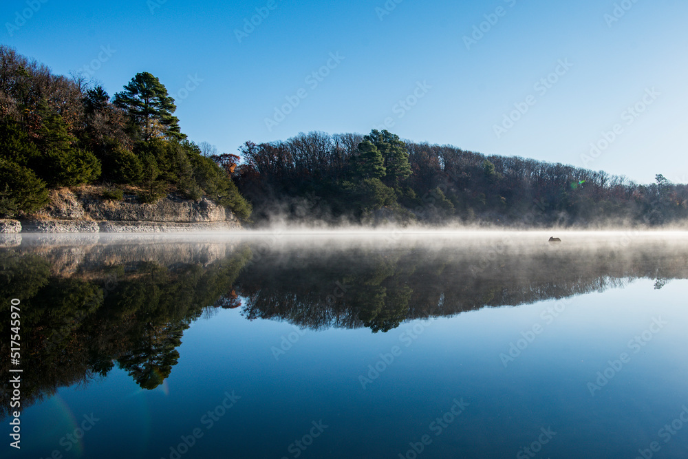 Crystal Lake in Decatur Arkansas with fog on the water Crystal Lake in Decatur Arkansas with fog on the water