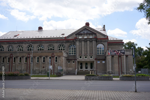 Rakovnik, Czech Republic - July 2, 2022 - modernist building from 1914 with a facade of white unplastered brick - Sokolovna - on a sunny summer afternoon photo