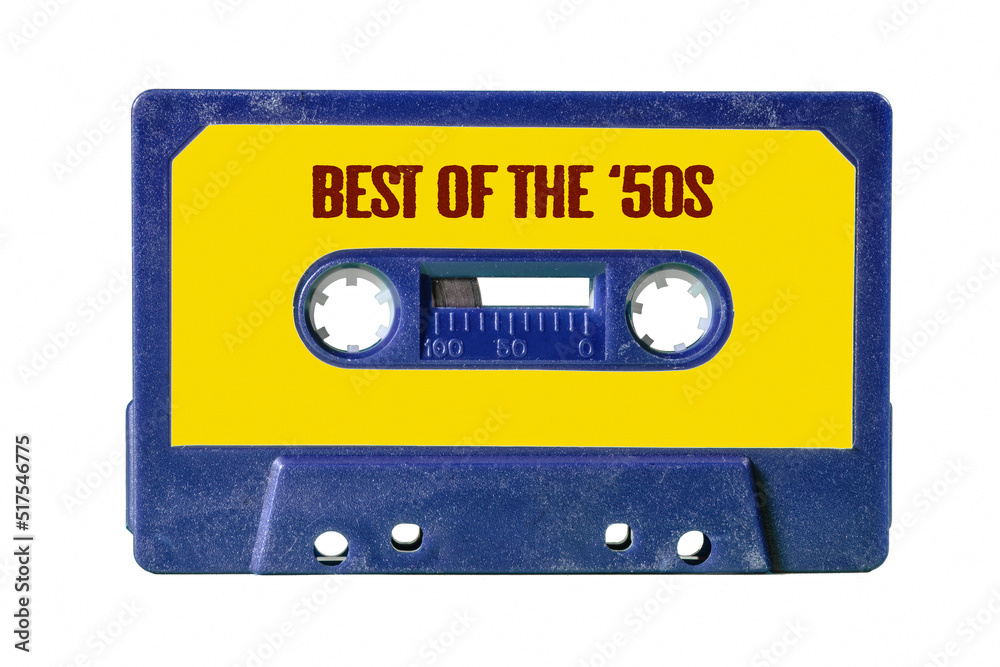 Obraz premium A blue retro vintage cassette tape (obsolete audio technology) with the text Best of the '50s written on the yellow label. 