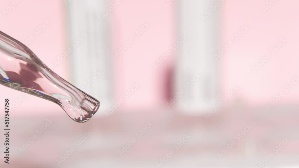 Pipette with serum close-up. A tripod for test tubes is visible in the reflection.Skin care products, natural cosmetics.Beauty concept for face and body care. High quality 4k footage Pipette with serum close-up. A tripod for test tubes is visible in the reflection.Skin care products, natural cosmetics.Beauty concept for face and body care. High quality 4k footage