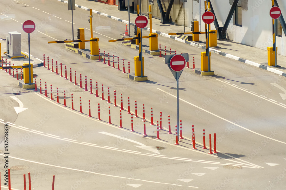 Obraz premium Road with multiple stop signs is prohibited and barriers