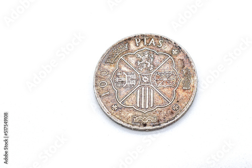 one hundred spanish old coins on white background