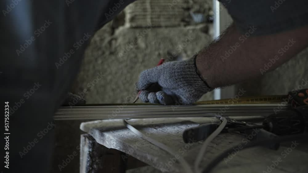 worker makes markup with a pencil worker makes markup with a pencil
