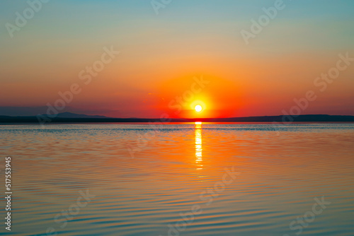 Sunset or sunrise over the lake. Nature or environment background photo